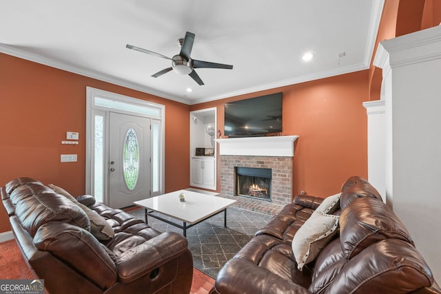 2670 Trotters Pointe Dr, Snellville, GA 30039 - living room with ceiling fan, a brick fireplace, ornamental molding, recessed lighting, and wood finished floors