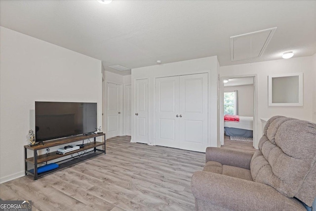 255 Morning Dr, Athens, GA 30606 - living room with attic access and light wood-style floors