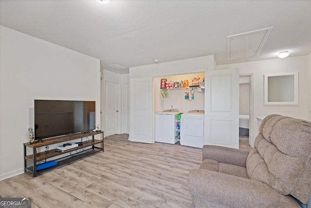 255 Morning Dr, Athens, GA 30606 - living room featuring attic access, light wood finished floors, and separate washer and dryer