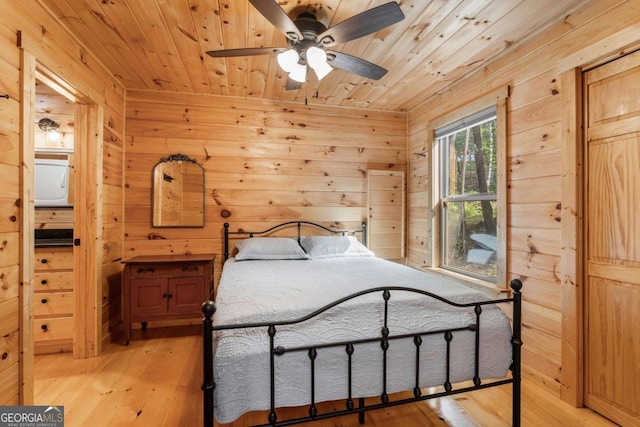 72 Bentley Cv, Murphy, NC 28960 - bedroom with wood ceiling, wood walls, and light wood-style flooring