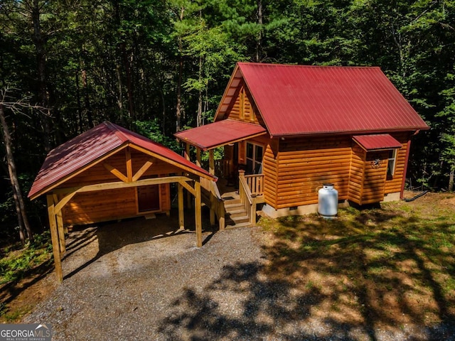 72 Bentley Cv, Murphy, NC 28960 - chalet / cabin with crawl space, a view of trees, a metal roof, gravel driveway, and a carport