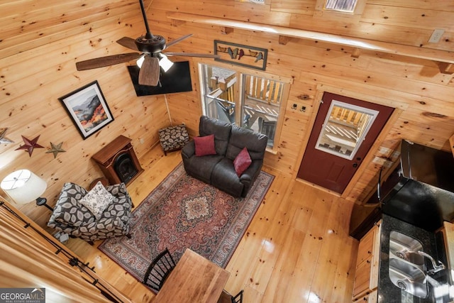 72 Bentley Cv, Murphy, NC 28960 - living room featuring ceiling fan, wooden walls, and hardwood / wood-style floors