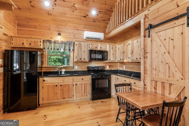 72 Bentley Cv, Murphy, NC 28960 - kitchen with black appliances, a wall unit AC, dark countertops, lofted ceiling, and light brown cabinetry