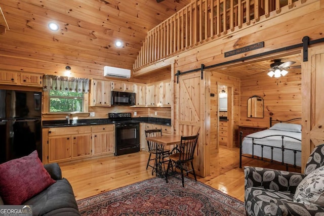72 Bentley Cv, Murphy, NC 28960 - kitchen featuring black appliances, a barn door, a wall mounted air conditioner, light wood-style flooring, and wooden ceiling