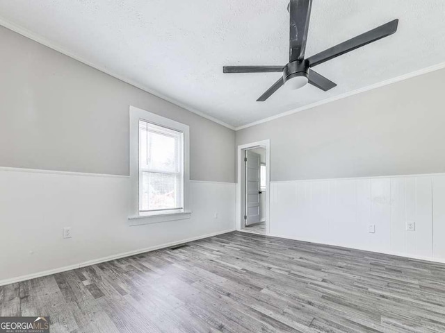 79 Hillside St, Nelson, GA 30151 - spare room with wood finished floors, ceiling fan, a textured ceiling, and ornamental molding
