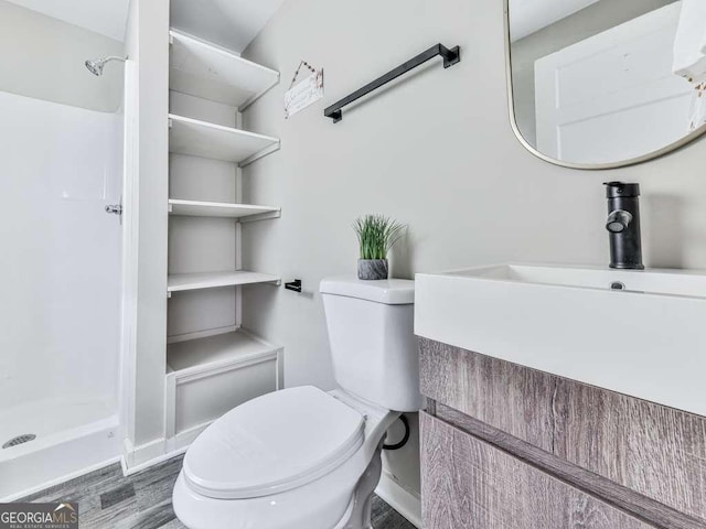 79 Hillside St, Nelson, GA 30151 - bathroom featuring a stall shower, wood finished floors, and vanity