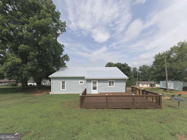 79 Hillside St, Nelson, GA 30151 - rear view of house featuring a lawn, a wooden deck, and a metal roof