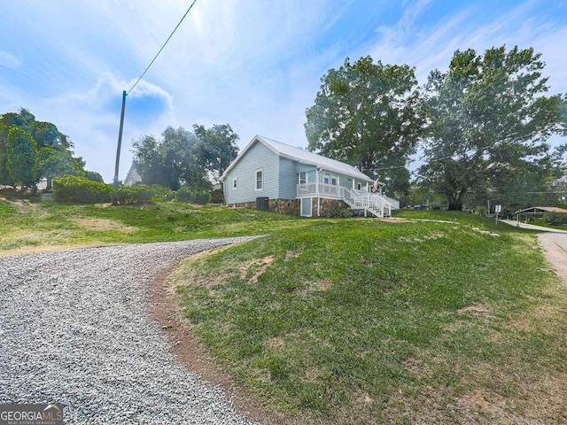 79 Hillside St, Nelson, GA 30151 - view of property exterior featuring stairs, a lawn, and stone siding