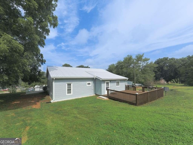 79 Hillside St, Nelson, GA 30151 - back of house with a deck, a lawn, and a metal roof