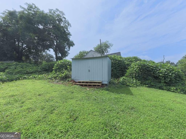 79 Hillside St, Nelson, GA 30151 - view of grassy yard with a storage unit