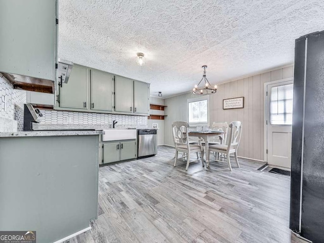 79 Hillside St, Nelson, GA 30151 - kitchen featuring dishwasher, light countertops, freestanding refrigerator, decorative backsplash, and a chandelier