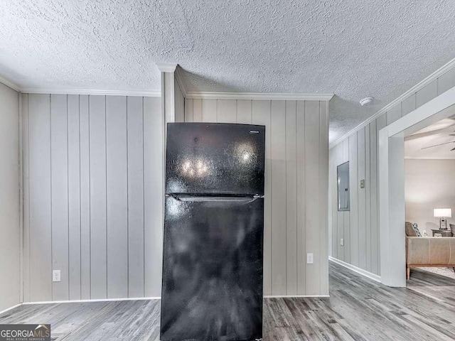79 Hillside St, Nelson, GA 30151 - detailed view of freestanding refrigerator, crown molding, wood finished floors, electric panel, and a smoke detector