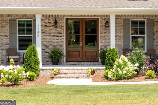1145 Summerfield Ln, Bogart, GA 30622 - doorway to property with covered porch, brick siding, and a shingled roof