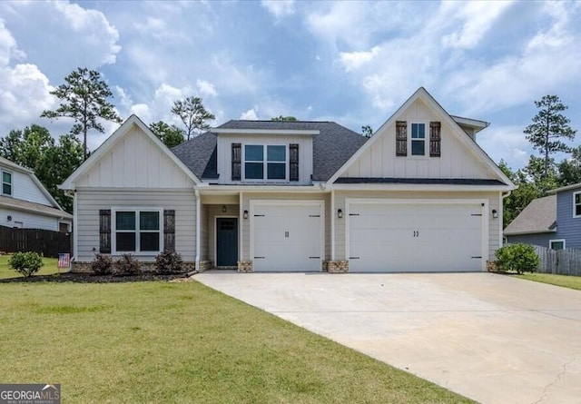 161 Fairway Cir, Macon, GA 31211 - view of front facade with board and batten siding, driveway, a shingled roof, and a garage