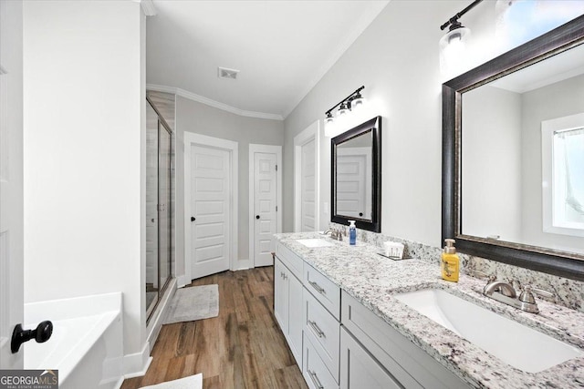 161 Fairway Cir, Macon, GA 31211 - full bath with a shower stall, a bath, wood finished floors, double vanity, and ornamental molding