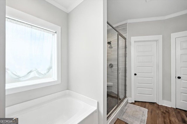 161 Fairway Cir, Macon, GA 31211 - bathroom featuring a shower stall, a garden tub, ornamental molding, and wood finished floors