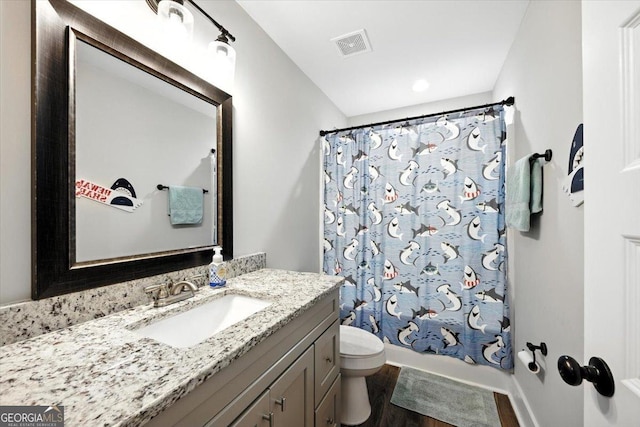 161 Fairway Cir, Macon, GA 31211 - full bath featuring vanity, wood finished floors, and shower / bath combination with curtain