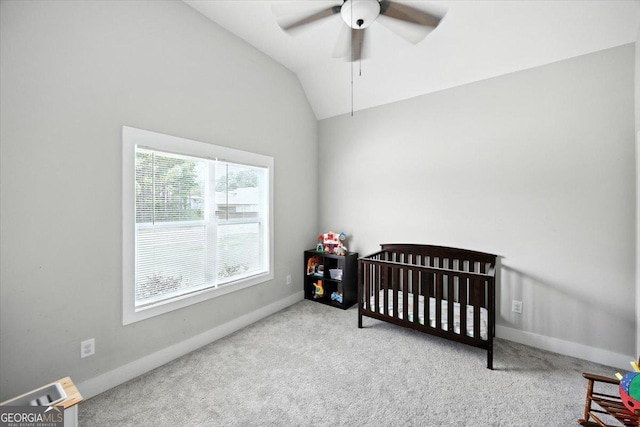 161 Fairway Cir, Macon, GA 31211 - carpeted bedroom with lofted ceiling, a crib, and ceiling fan