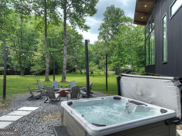 211 Rockhouse Rd, Cherry Log, GA 30522 - view of patio / terrace featuring a hot tub, a fire pit, and view of scattered trees