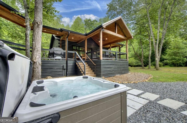 211 Rockhouse Rd, Cherry Log, GA 30522 - back of house featuring a hot tub and stairs