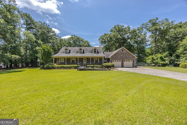 171 Loraine Forest Dr, Macon, GA 31210 - cape cod-style house with concrete driveway, an attached garage, covered porch, and a front lawn
