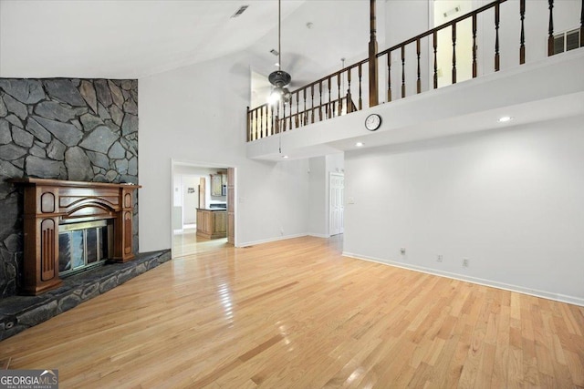 171 Loraine Forest Dr, Macon, GA 31210 - unfurnished living room featuring wood finished floors, high vaulted ceiling, a fireplace, and ceiling fan