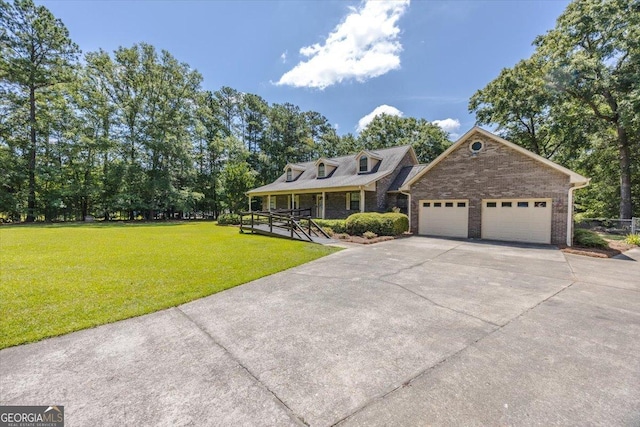 171 Loraine Forest Dr, Macon, GA 31210 - cape cod-style house featuring concrete driveway, a front lawn, an attached garage, and a porch