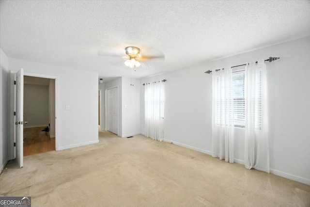171 Loraine Forest Dr, Macon, GA 31210 - unfurnished bedroom with light carpet, a textured ceiling, and ceiling fan