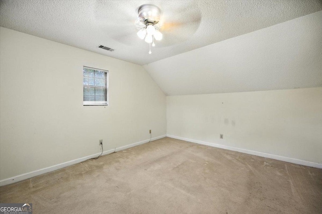 171 Loraine Forest Dr, Macon, GA 31210 - bonus room featuring ceiling fan, light carpet, vaulted ceiling, and a textured ceiling