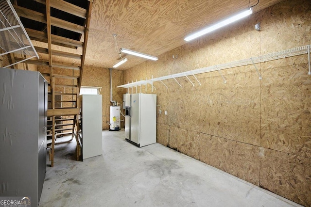 171 Loraine Forest Dr, Macon, GA 31210 - garage with white refrigerator with ice dispenser, gas water heater, and freestanding refrigerator