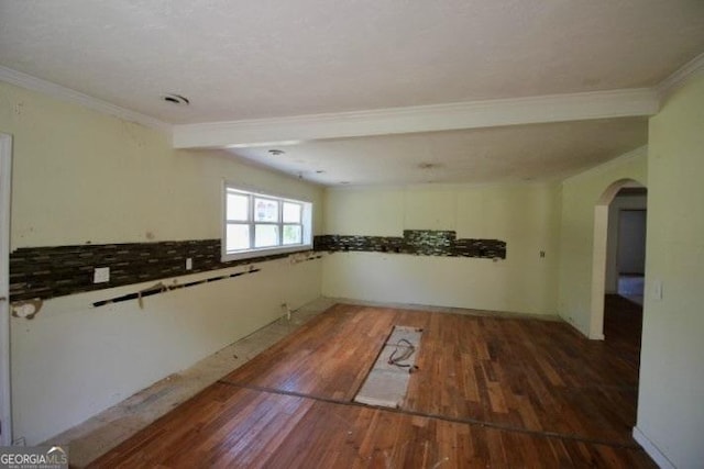 102 Ashley Ln, Mcrae, GA 31055 - spare room featuring wood finished floors, arched walkways, and ornamental molding