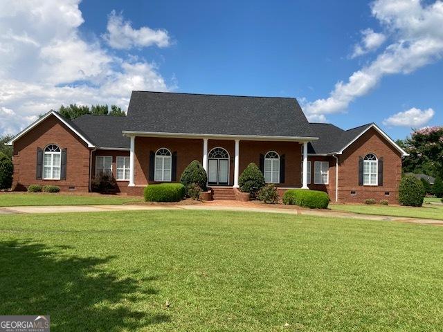550 Masters Cir, Dublin, GA 31021 - view of front of home featuring crawl space, brick siding, and a front yard