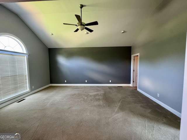 550 Masters Cir, Dublin, GA 31021 - carpeted spare room with vaulted ceiling and ceiling fan