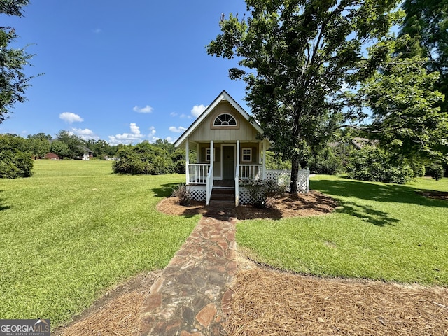 550 Masters Cir, Dublin, GA 31021 - view of front of home featuring covered porch and a front yard