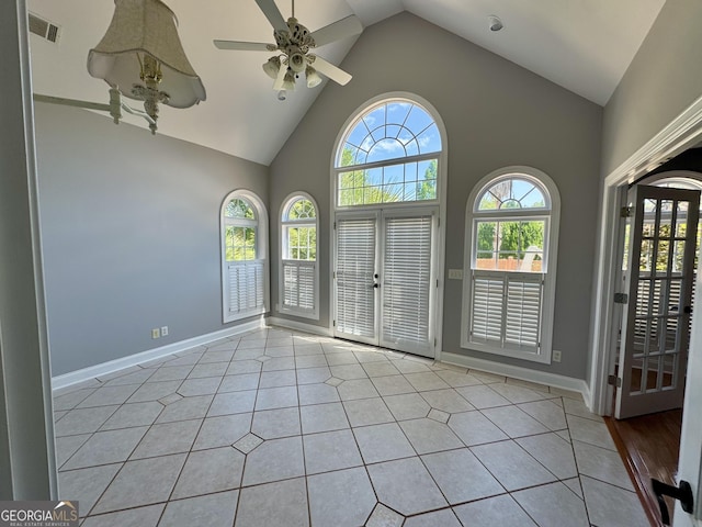 550 Masters Cir, Dublin, GA 31021 - tiled spare room with ceiling fan and high vaulted ceiling