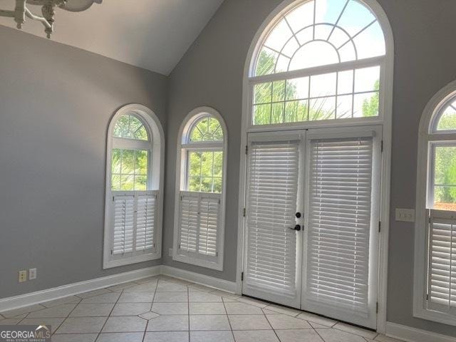 550 Masters Cir, Dublin, GA 31021 - unfurnished room featuring light tile patterned floors and high vaulted ceiling