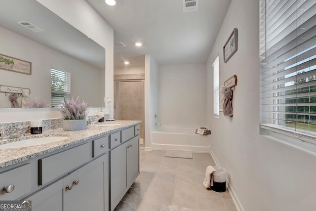 7730 Demeter Dr, Fairburn, GA 30213 - bathroom featuring a garden tub, tile patterned floors, double vanity, a shower stall, and recessed lighting