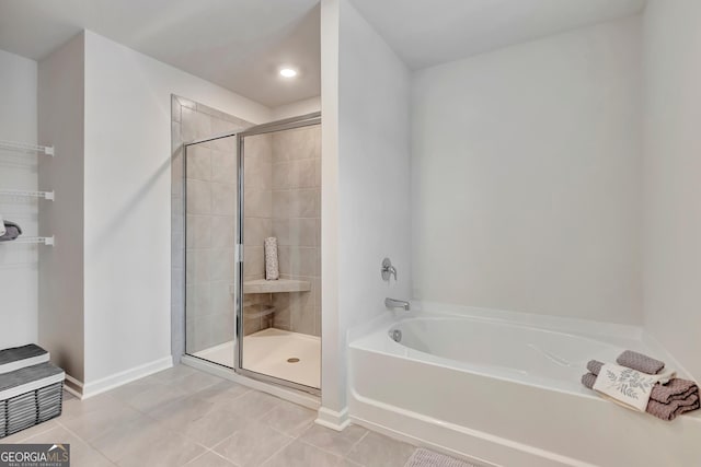 7730 Demeter Dr, Fairburn, GA 30213 - bathroom featuring a garden tub, a stall shower, and tile patterned flooring