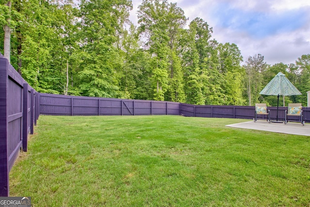 7730 Demeter Dr, Fairburn, GA 30213 - fenced backyard featuring a patio