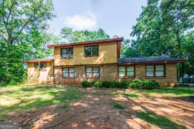 1025 Northridge Rd, Ball Ground, GA 30107 - tri-level home with a chimney and brick siding