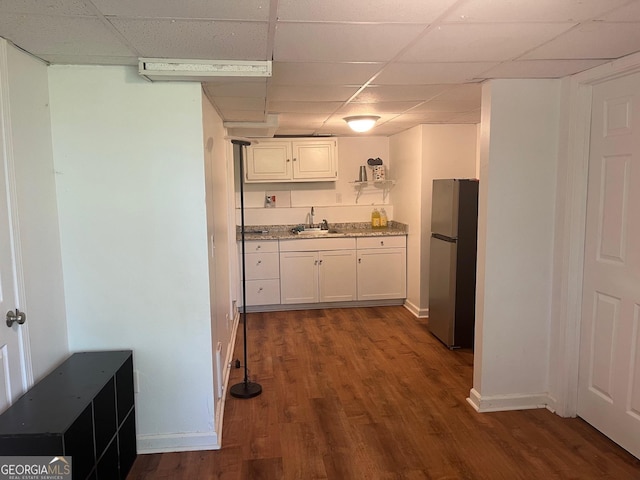 1025 Northridge Rd, Ball Ground, GA 30107 - kitchen with freestanding refrigerator, a paneled ceiling, dark wood-style floors, white cabinetry, and light stone counters