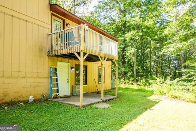 1025 Northridge Rd, Ball Ground, GA 30107 - rear view of property with a lawn and a deck