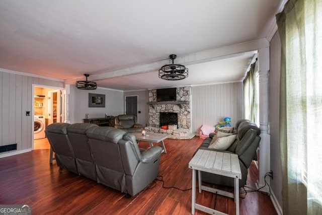 1025 Northridge Rd, Ball Ground, GA 30107 - living area with washer / clothes dryer, wood finished floors, a stone fireplace, wooden walls, and ceiling fan
