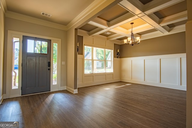 776 Fleeting Way, Monroe, GA 30655 - entryway with a chandelier, a decorative wall, beam ceiling, dark wood finished floors, and crown molding