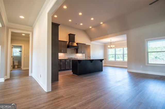776 Fleeting Way, Monroe, GA 30655 - kitchen with premium range hood, crown molding, a kitchen breakfast bar, a chandelier, and open floor plan