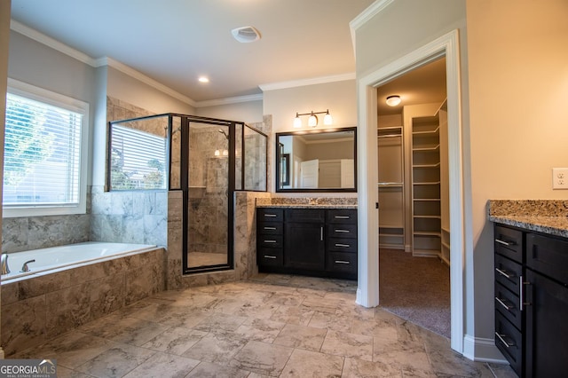 776 Fleeting Way, Monroe, GA 30655 - bathroom featuring vanity, a stall shower, a garden tub, a walk in closet, and ornamental molding