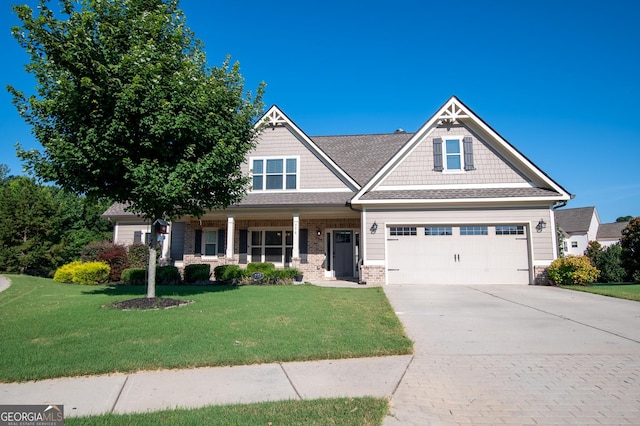 776 Fleeting Way, Monroe, GA 30655 - craftsman inspired home with concrete driveway, a front lawn, a porch, brick siding, and an attached garage