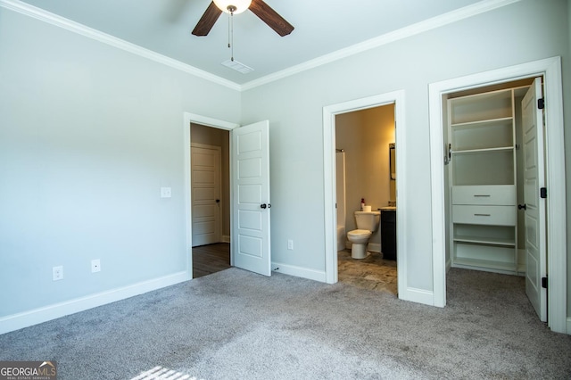 776 Fleeting Way, Monroe, GA 30655 - unfurnished bedroom featuring carpet flooring, a walk in closet, crown molding, a closet, and ensuite bath