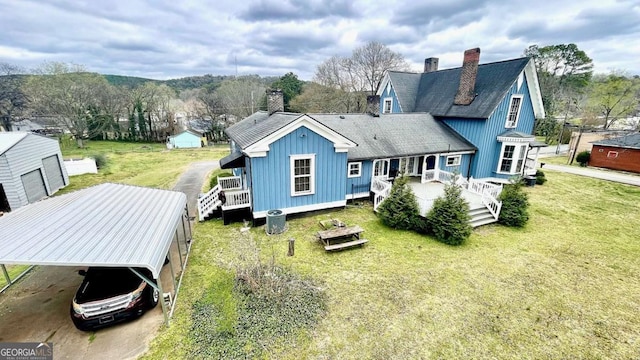 6 River St SW, Cave Spring, GA 30124 - rear view of house featuring a chimney, a lawn, roof with shingles, a deck, and board and batten siding