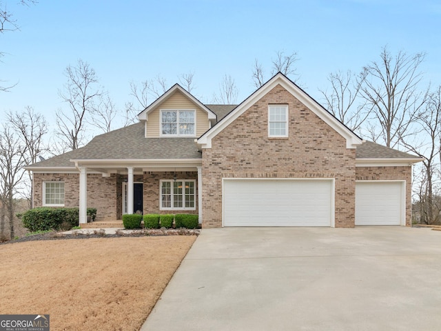 17 Rocky Mountain Pass, Adairsville, GA 30103 - view of front of home with concrete driveway, covered porch, brick siding, and roof with shingles